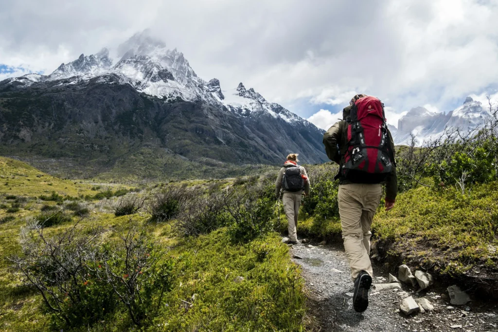 person checking hiking gear before outdoor adventure